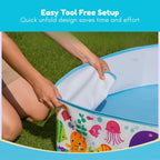 Person setting up a colorful inflatable pool with cartoon animals on grass, text 'Easy Tool Free Setup' above.