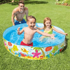 Children playing in a inflatable pool with a cartoon design on a grassy lawn.